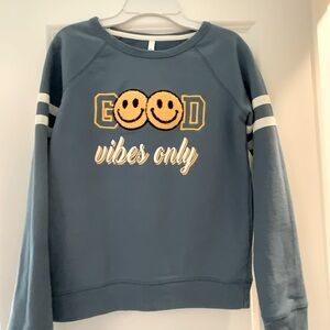 Blue Sweatshirt with Smiley Face Design